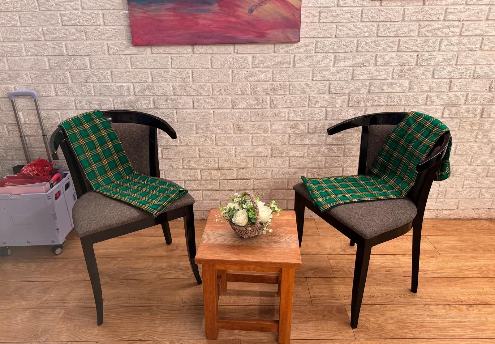 Comfortable chair with tartan throw in the Mwanga assessment room